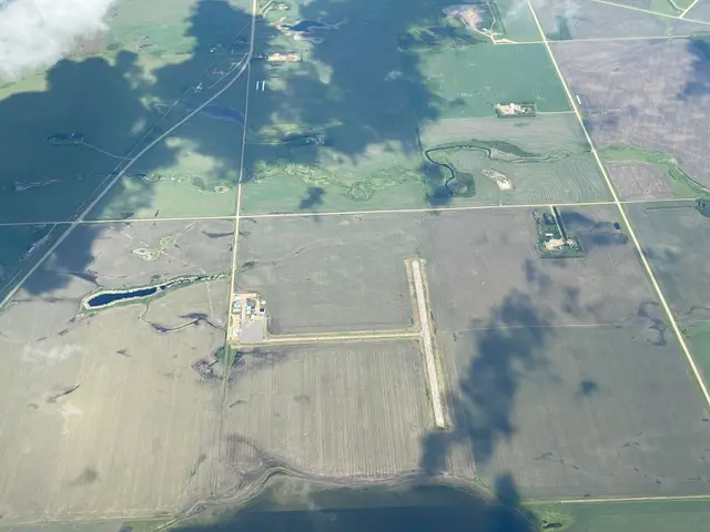 Aerial view of farmland and a small airstrip
